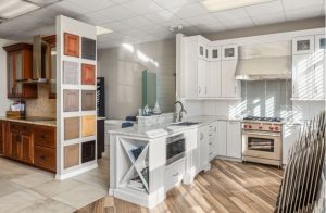 Inside S&W Kitchens Melbourne showroom white kitchen with selection boards