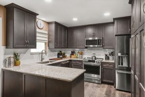 S&W Kitchen Remodel Tampa with brown cabinets and peninsula counter