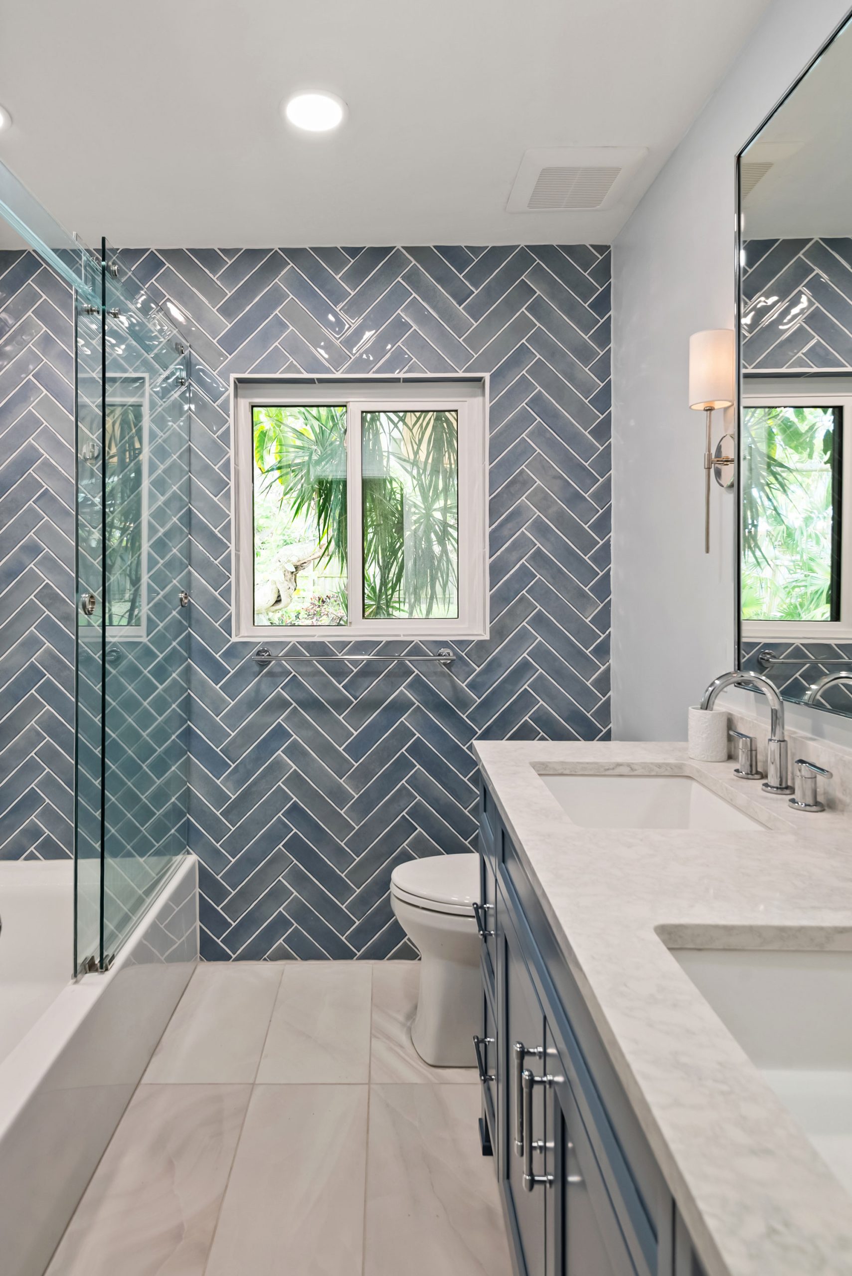 S&W Kitchens Tampa bathroom remodel herringbone blue tile accent wall