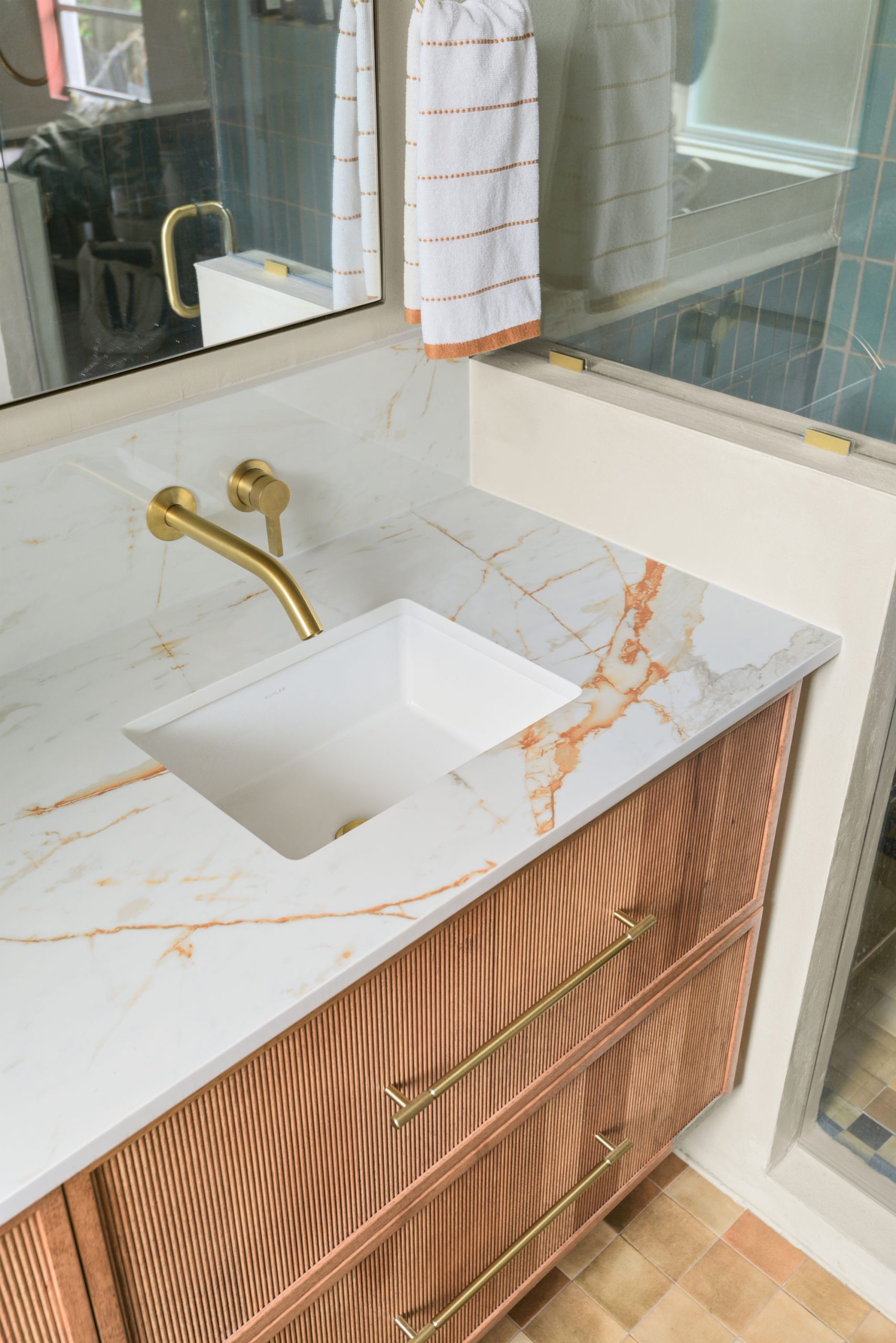 Oregon Street bathroom remodel project sink and brass fixture
