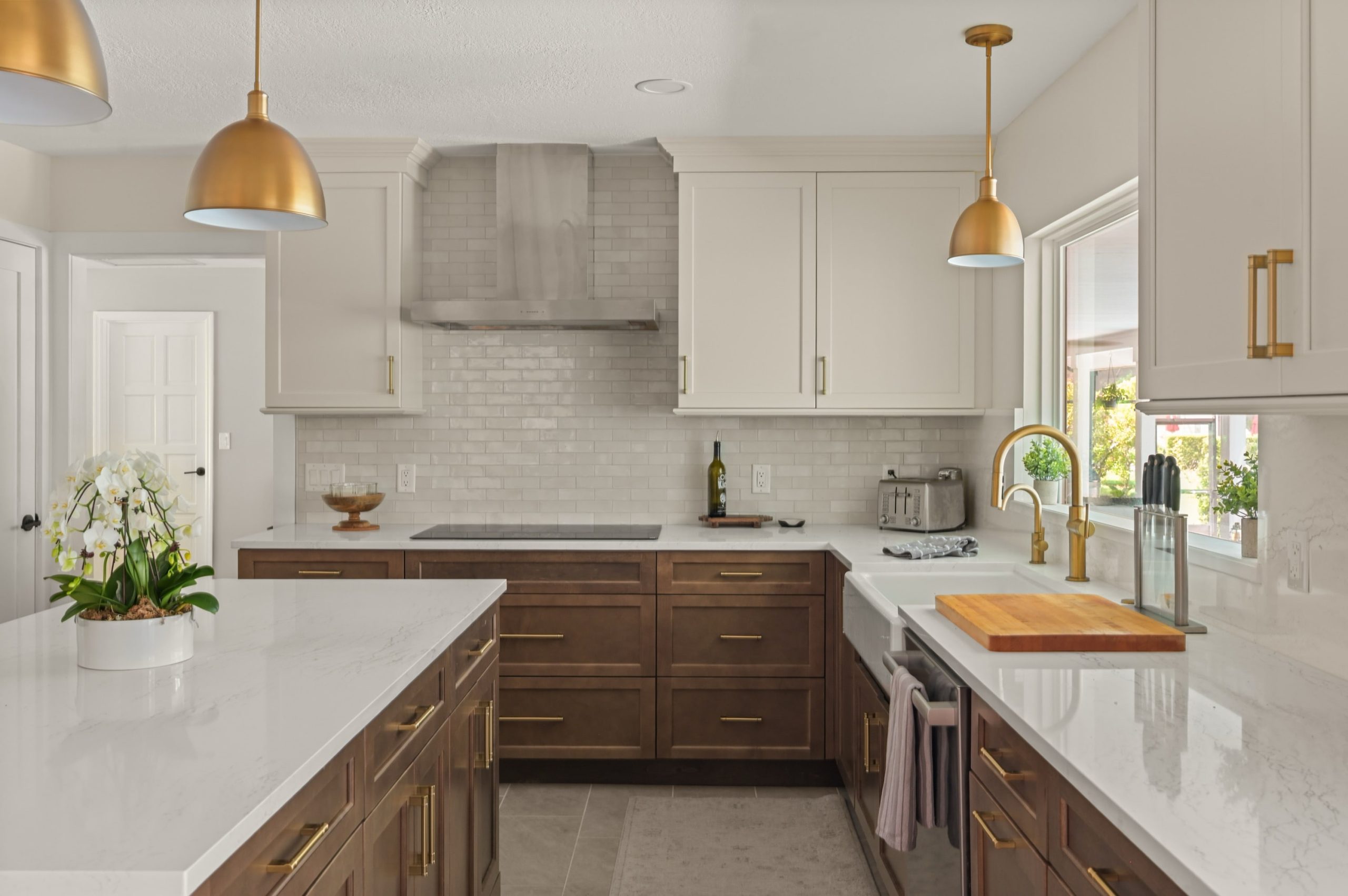 Sweetwater two tone cabinets with hood and cook top