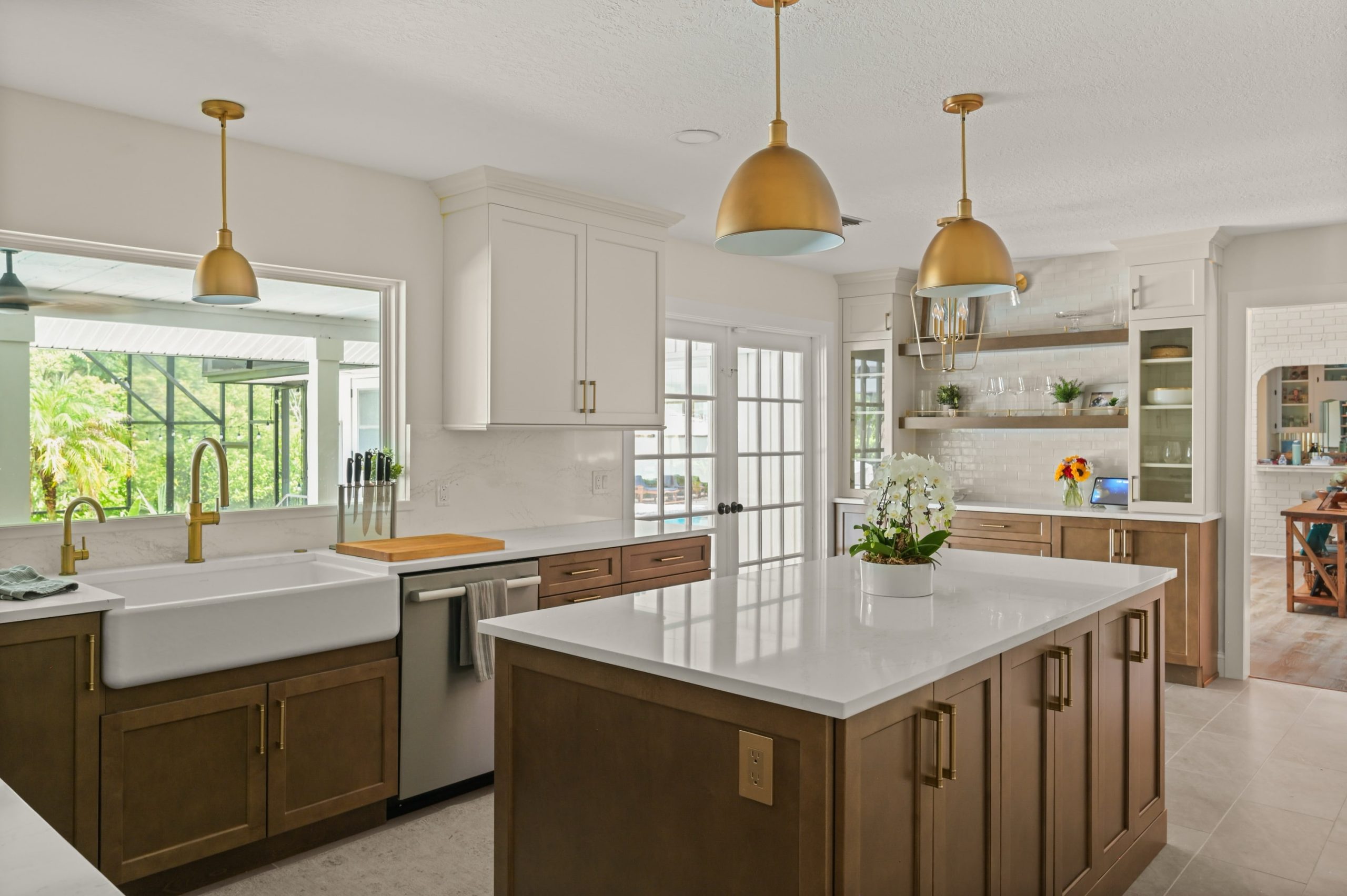 Sweetwater kitchen remodel islance with wood cabinets, farmhouse sink and floating shelves